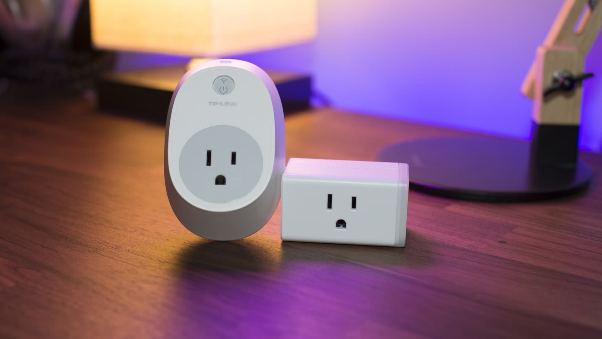 Large and small TP link smart plugs next to one another
