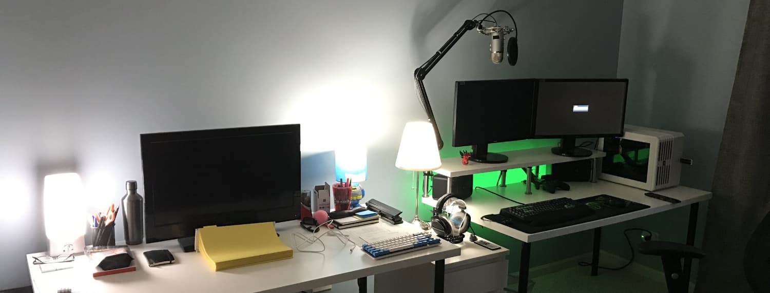 A room containing two desks with monitors and a computer