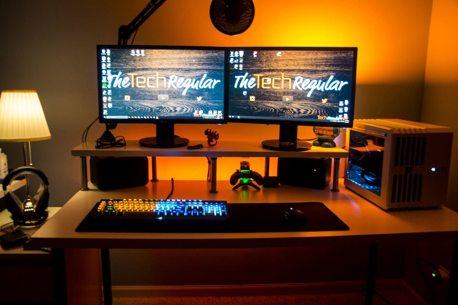 Desk with computer, monitors, and keyboard