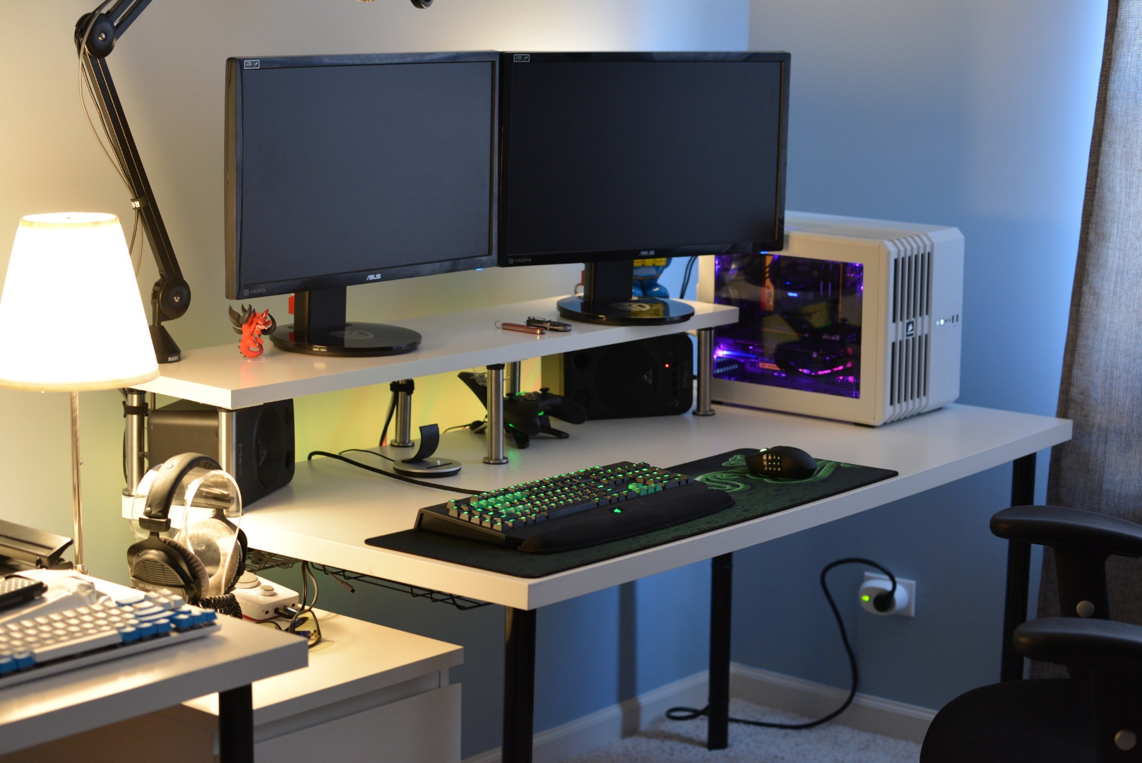 A desk with monitors, a computer, and the BlackWidow Ultimate 2014
